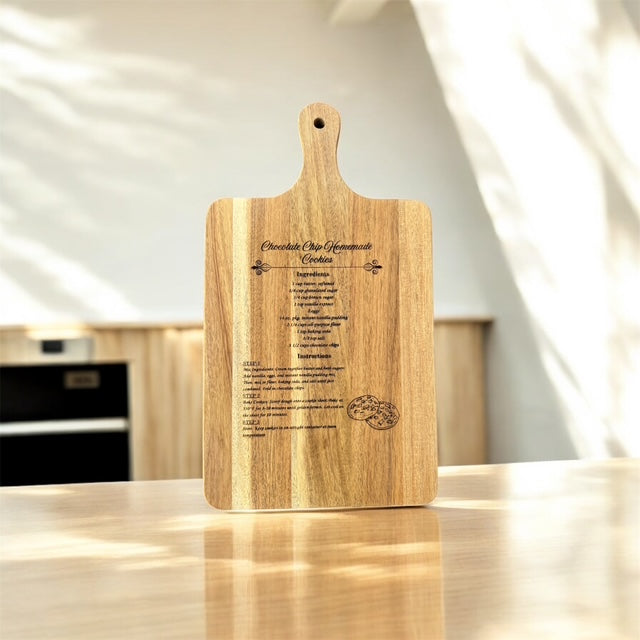 Engraved wooden cutting board featuring a classic chocolate chip cookie recipe. A perfect keepsake gift for bakers and kitchen décor lovers.